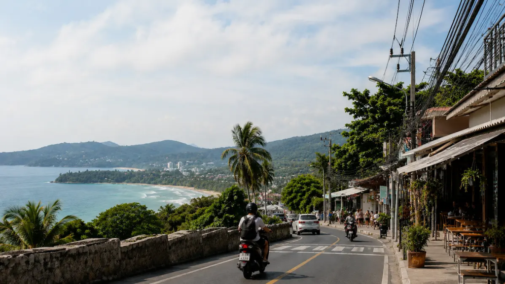 Coastal road and local cafes overlooking Phuket coastline in Thailand, representing modern destination publishing rooted in Phuket travel culture and everyday island life.