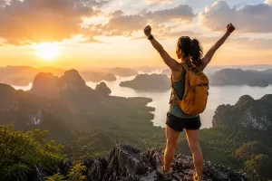 Image of girl standing on top of mountain after a success for the travel with insight achievement category.
