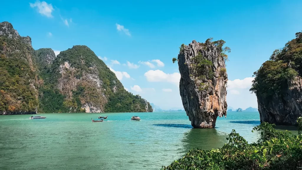James Bond Island in Phang Nga Bay, one of the must-see attractions in Southern Thailand, featuring its iconic limestone pinnacle.