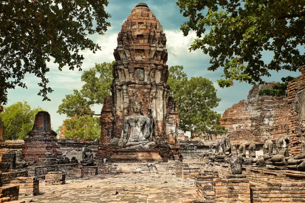 Must see attractions Thailand featuring the ancient temple ruins of Ayutthaya Historical Park, a UNESCO World Heritage Site.