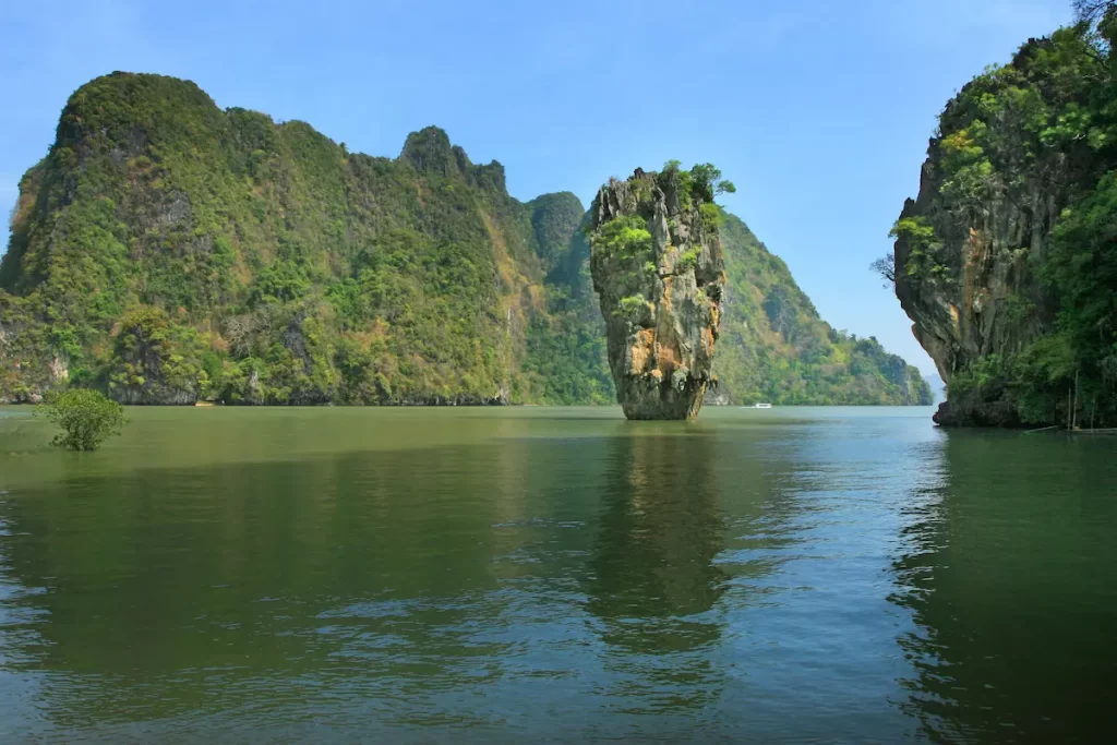 Must see attractions Thailand featuring James Bond Island in the spectacular limestone karsts of Phang Nga Bay.