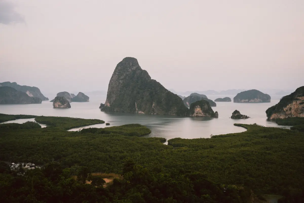 Panoramic view of Phang Nga Bay with limestone karsts and mangrove forests, one of the must-see attractions in Southern Thailand.