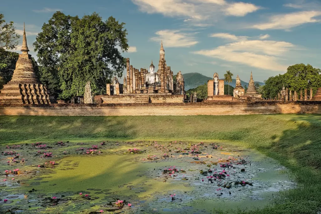 Why visit Thailand? Ancient temples and historic ruins at Sukhothai Historical Park showcase Thailand's rich cultural heritage.