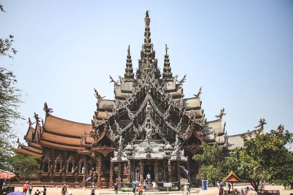 The Sanctuary of Truth in Pattaya, one of the best temples in Thailand, showcasing its intricate handcrafted wooden architecture