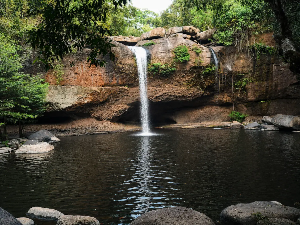 Beautiful Waterfalls In Thailand: Haew Suwat Waterfall in Khao Yai National Park cascading into a tranquil forest pool.