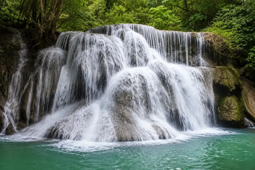 Beautiful Waterfalls In Thailand: Huai Mae Khamin Waterfall in Kanchanaburi with seven limestone tiers and crystal-clear turquoise pools.