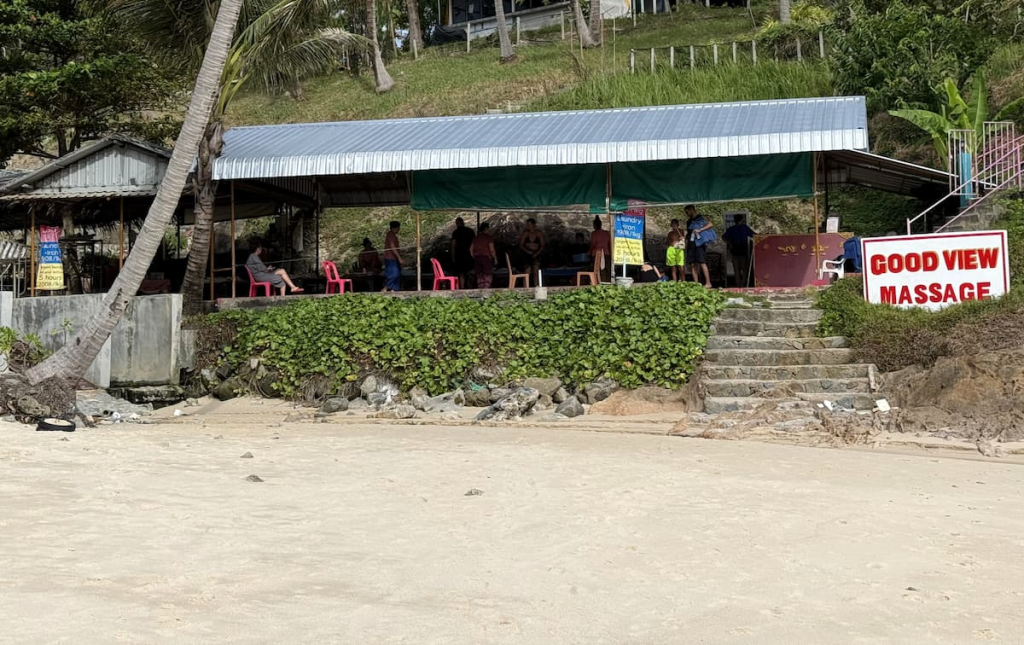 Beachside massage area at Merlin Beach with massage beds overlooking the sand