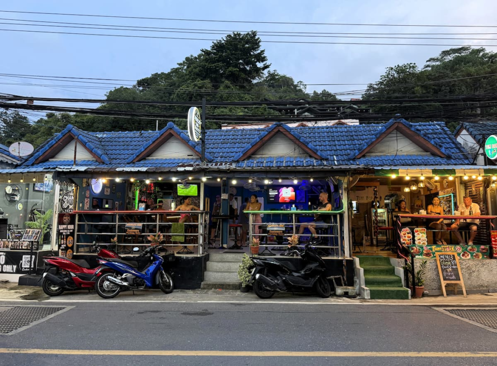 Open-air bars and restaurants along Nanai Road in Patong during the evening