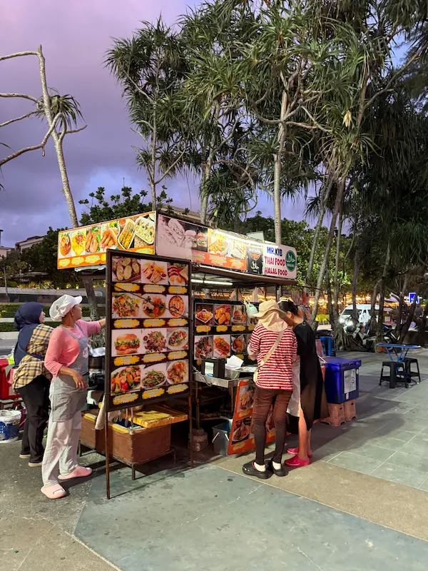 A beachfront food stall serving Thai dishes and grilled seafood featured in our Patong Travel Guide.