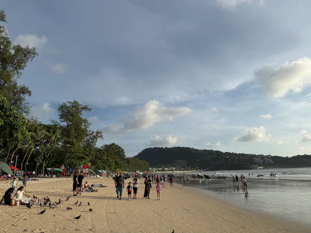 Best time to visit Patong during the green season with visitors enjoying Patong Beach in July