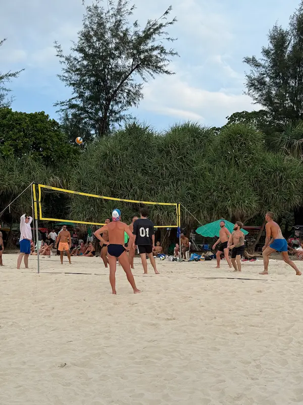 Visitors playing beach volleyball on the northern section of Patong Beach near Loma Park, a popular recreational area for locals and travellers.