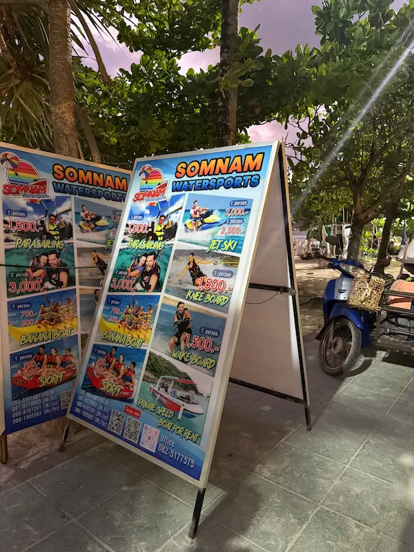 Water sports information board showing activities and prices at Patong Beach featured in our Patong Travel Guide.