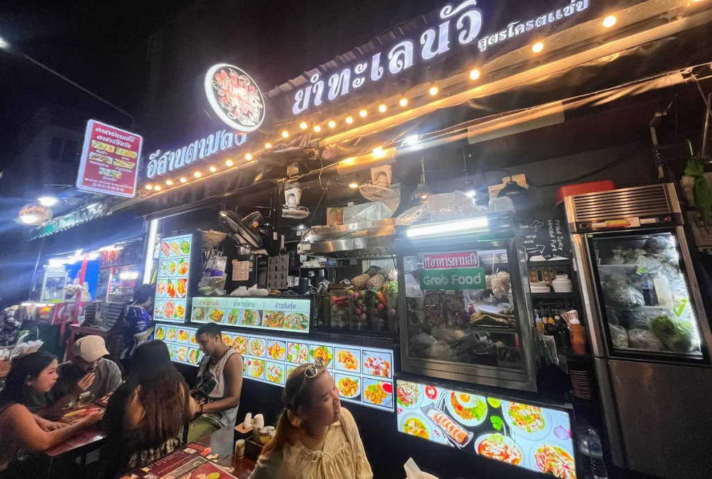 Popular street food restaurant with outdoor seating and Thai menu in Patong