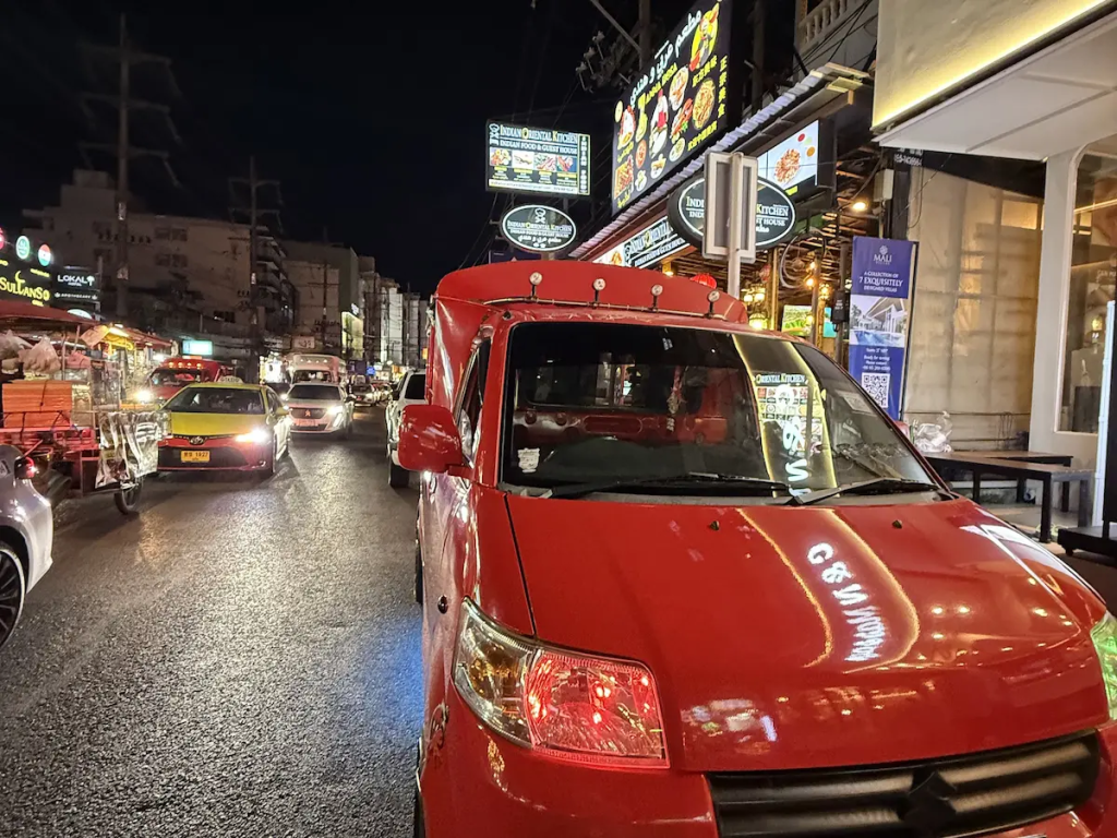 Traffic and local transport along a busy Patong street, showing how easy it is to visit Patong without a car.