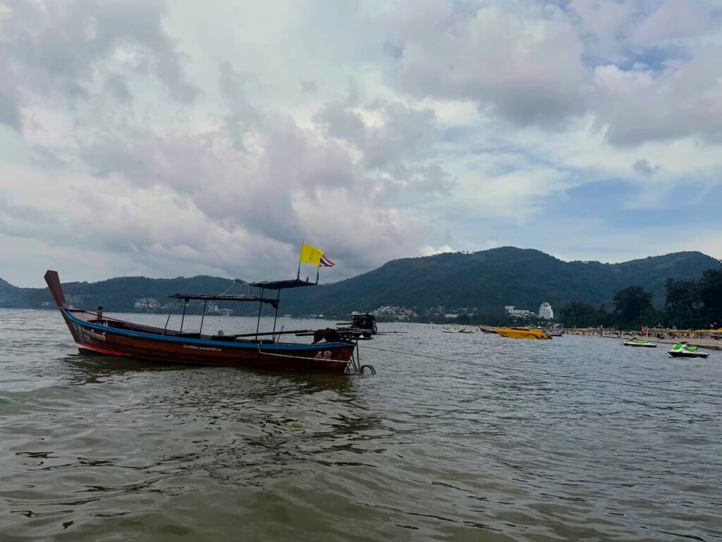 Traditional longtail boat available for private hire during water sports in Patong, Phuket.