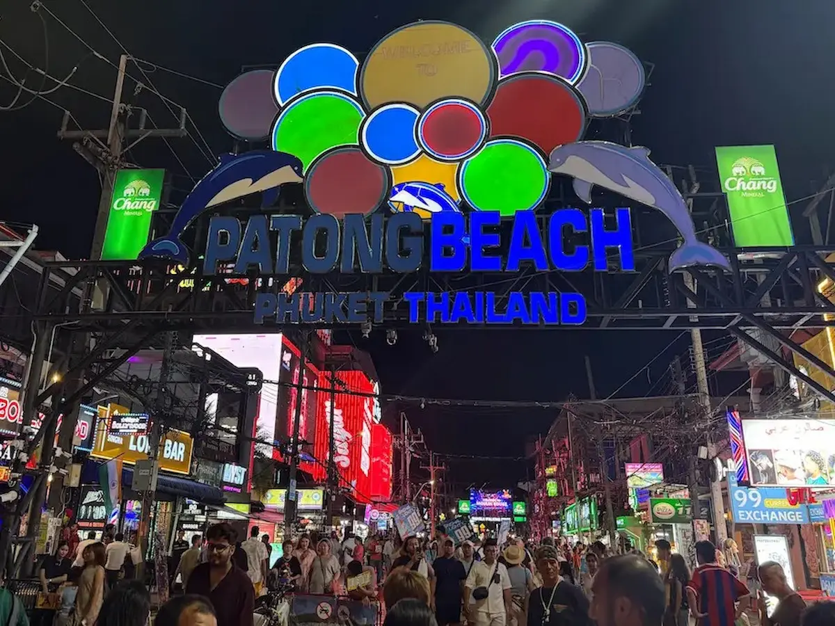 Bangla Road nightlife and crowds beneath the Patong Beach entrance sign, one of the most popular things to do in Patong.