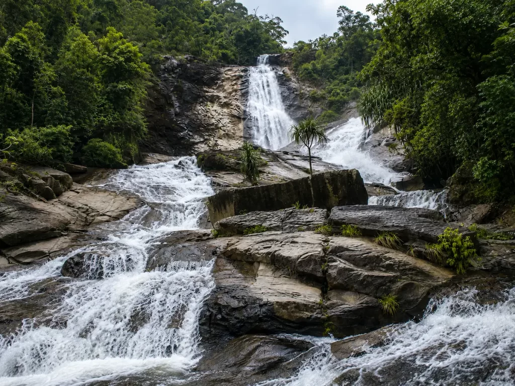 Beautiful Waterfalls In Thailand: Ton Nga Chang Waterfall in Songkhla cascading through lush rainforest within Ton Nga Chang Wildlife Sanctuary.
