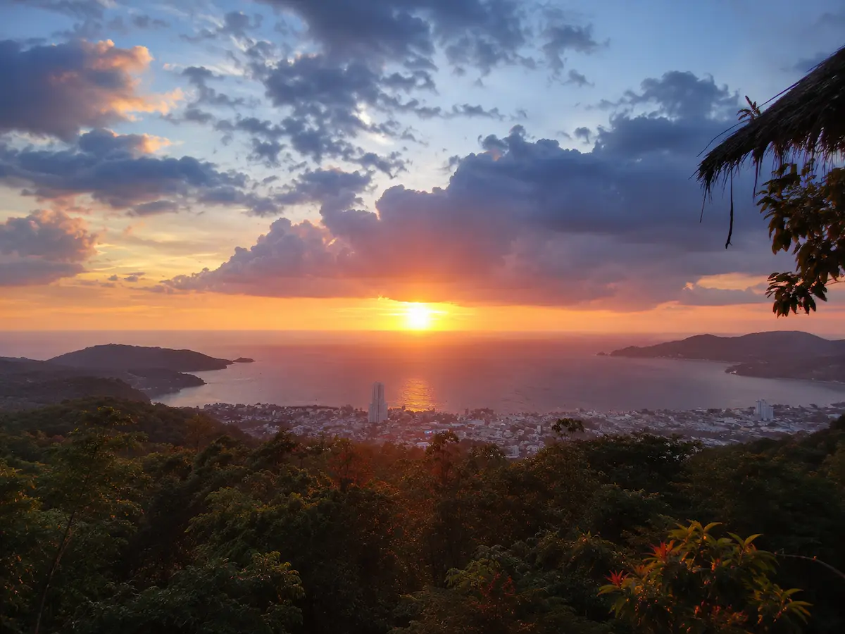 Featured image for understanding patong that is a panoramic view over Patong Bay from an Inland Patong viewpoint, showing the beaches, town centre and surrounding hills that help visitors understand Patong's layout.