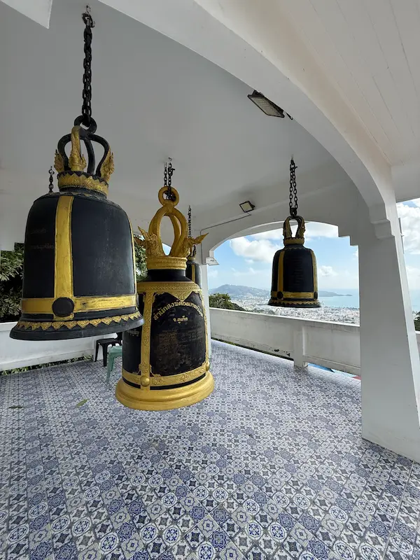 Temple bells inside the Bell Pavilion overlooking Patong at Wat Doi Thep Nimit in Phuket.
