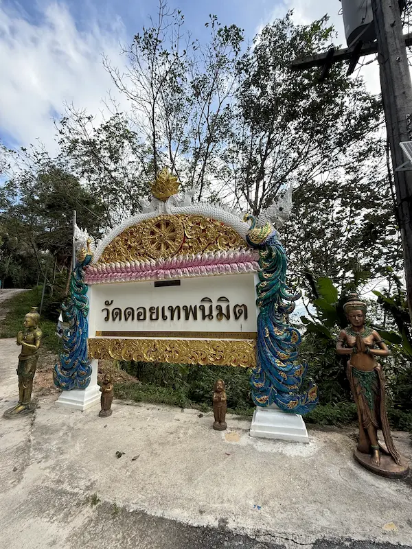 Entrance sign for Wat Doi Thep Nimit in Phuket, marking the entrance to the peaceful hillside monastery above Patong.
