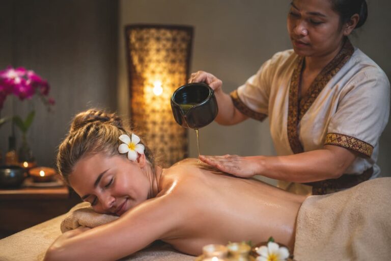 Luxury spa treatment illustrating the wellness and spas in Patong, with a therapist providing a relaxing aromatherapy massage.