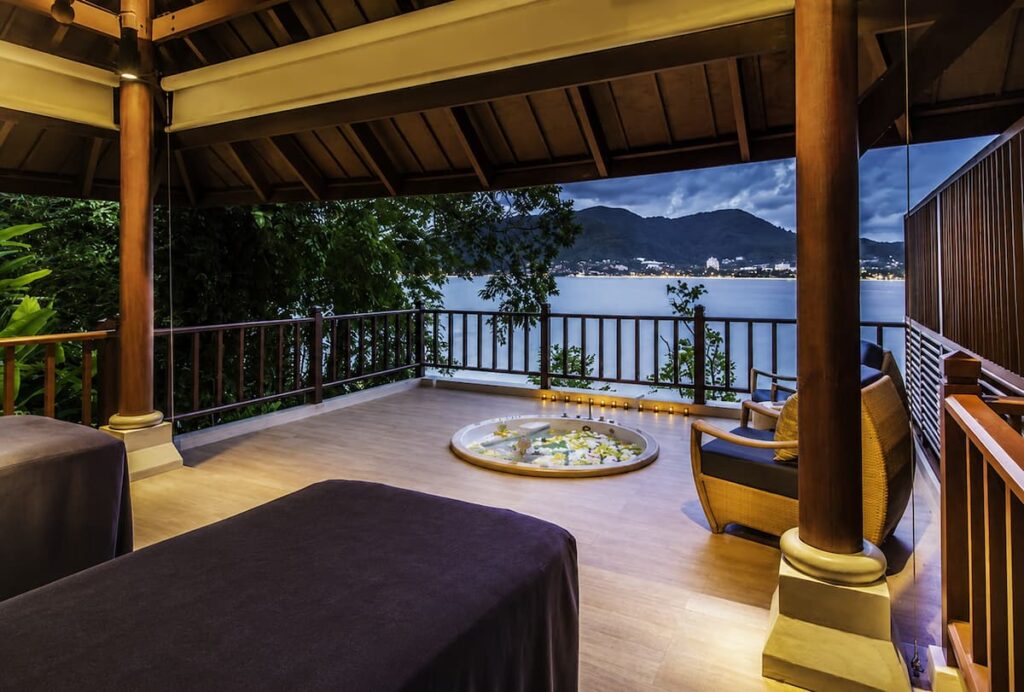 Luxury treatment room overlooking Patong Bay at Breeze Spa at Amari Phuket, featured in our Patong Travel Guide as one of Patong's premier wellness experiences.