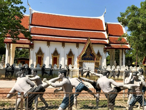 Muay Thai fighter statues at historic Bang Kung Camp beside Wat Bang Kung