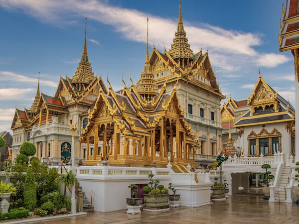 Ornate traditional Thai buildings within the Grand Palace complex in Bangkok.