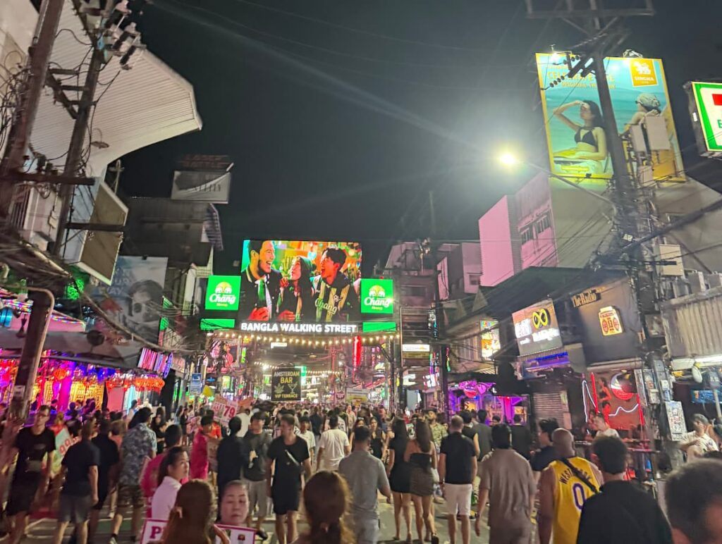 Crowds walking beneath the Bangla Walking Street sign during a busy evening in Patong, Phuket.