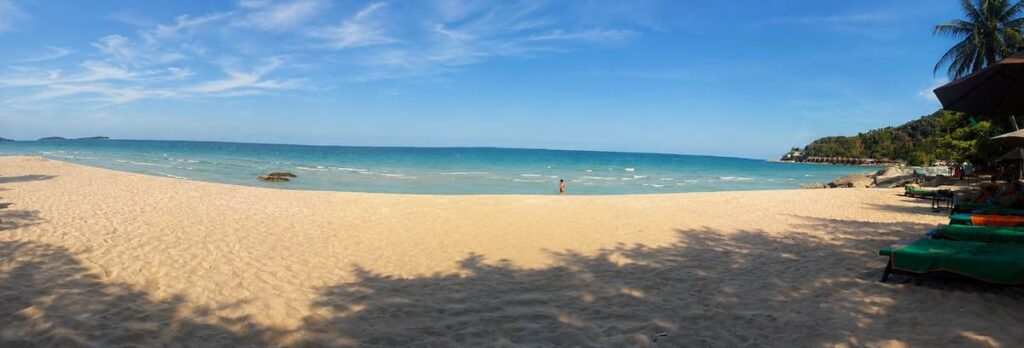 Wide sandy shoreline and beachfront loungers at Chaweng Beach on Koh Samui