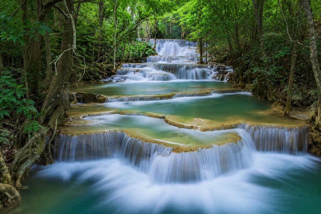 Tiered pools of Erawan Waterfall, one of the must-see attractions in Central Thailand.