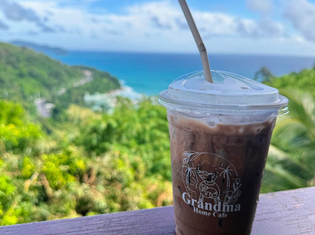 Iced cocoa at Grandma Homemade Thai Food with tropical hillside and Andaman Sea views near Patong