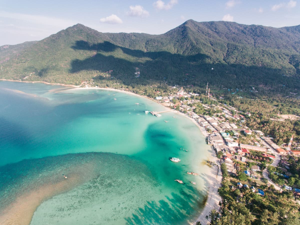 Aerial view of Chaloklum Bay on Koh Phangan along a Southern Thailand island-hopping route.