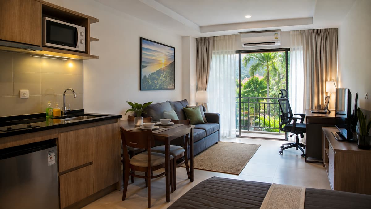 Long-stay accommodation in Patong featuring a kitchenette, workspace and balcony in our Patong Travel Guide.