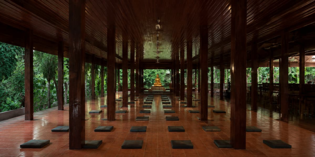 Thailand travel guide view inside the open-sided forest meditation hall at Wat Pa Tam Wua in Mae Hong Son.