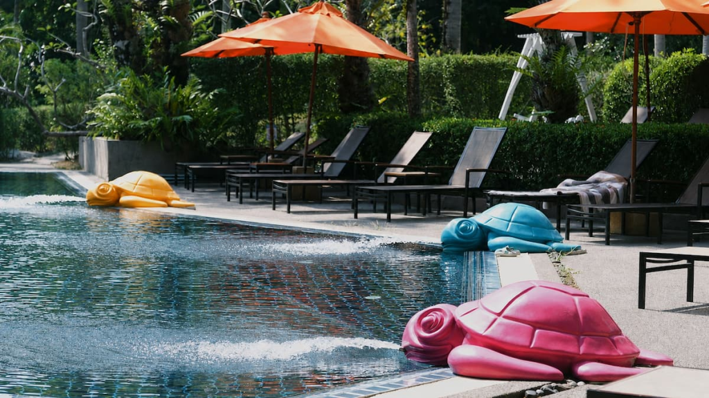Pool with colourful turtle fountains at Nai Yang Beach Resort & Spa, featured in our Phuket travel guide.