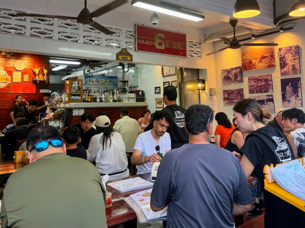 Inside No. 6 Restaurant in the Patong Travel Guide, showing the busy dining area, limited seating and casual atmosphere.