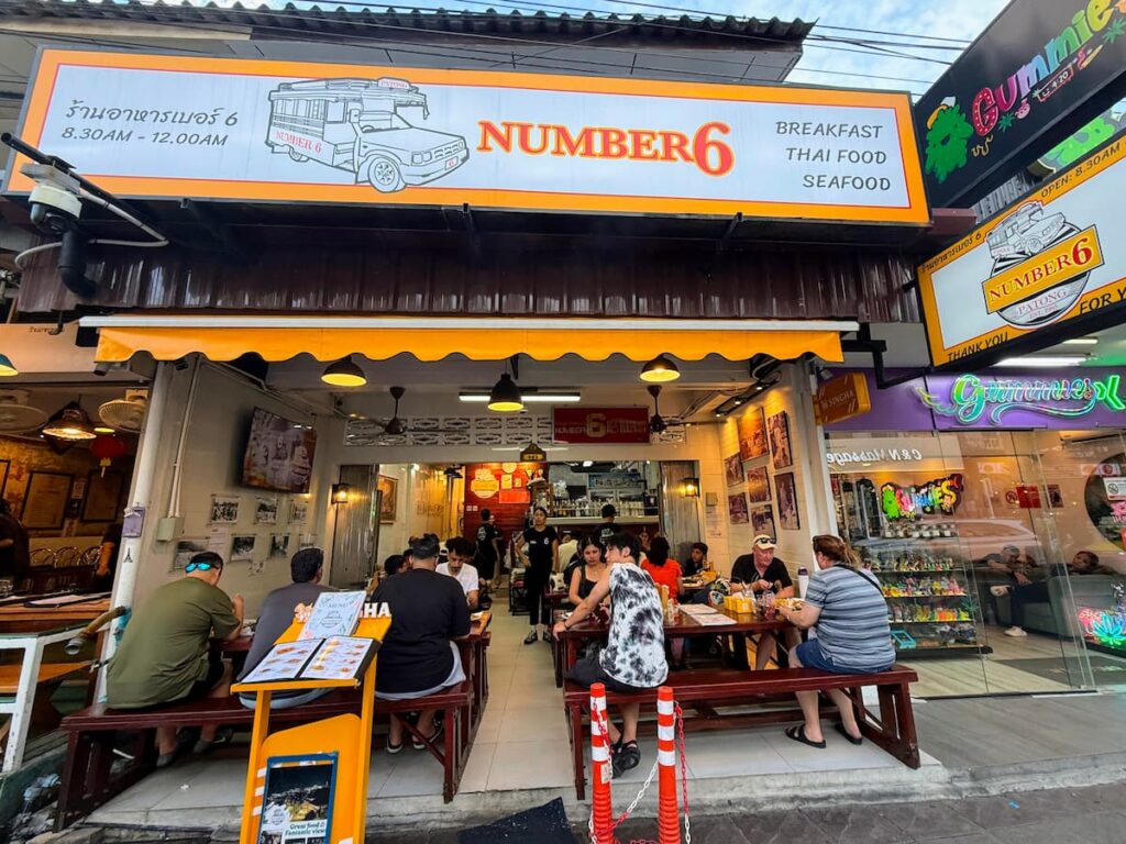 No. 6 Restaurant in the Patong Travel Guide, showing the busy street-front entrance and outdoor seating in central Patong.