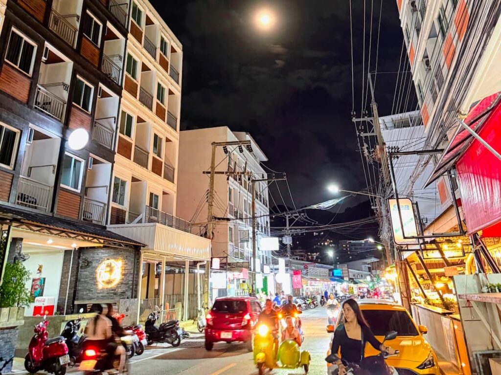 Busy Patong street showing why hotel location and walking distance matter when choosing accommodation
