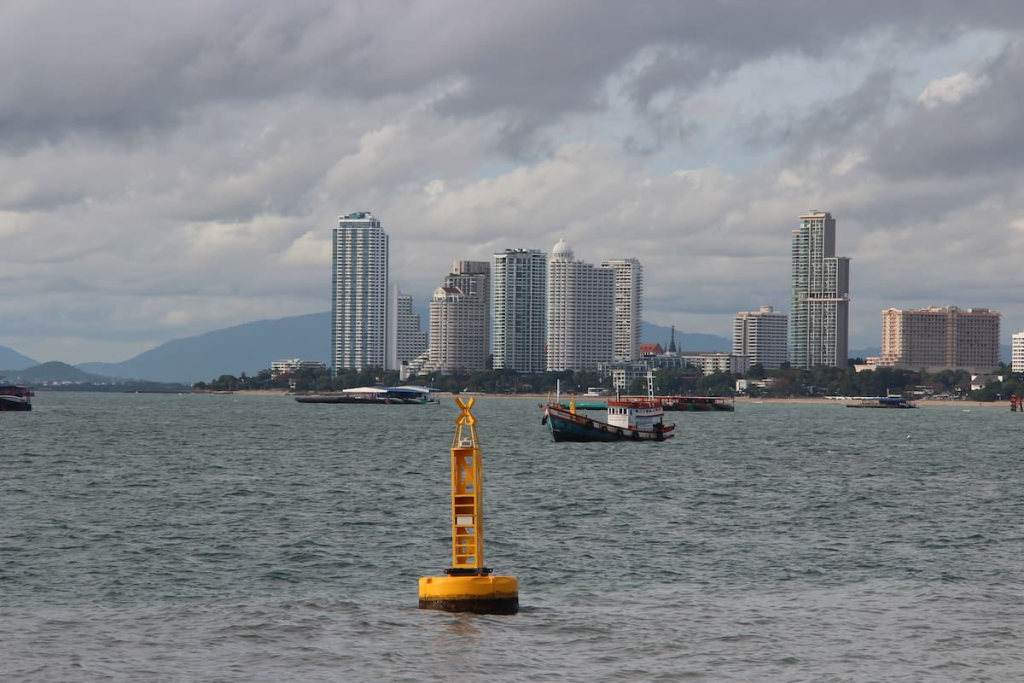 Thailand travel guide view of boats and the high-rise Pattaya waterfront around Wong Amat from the Gulf of Thailand.