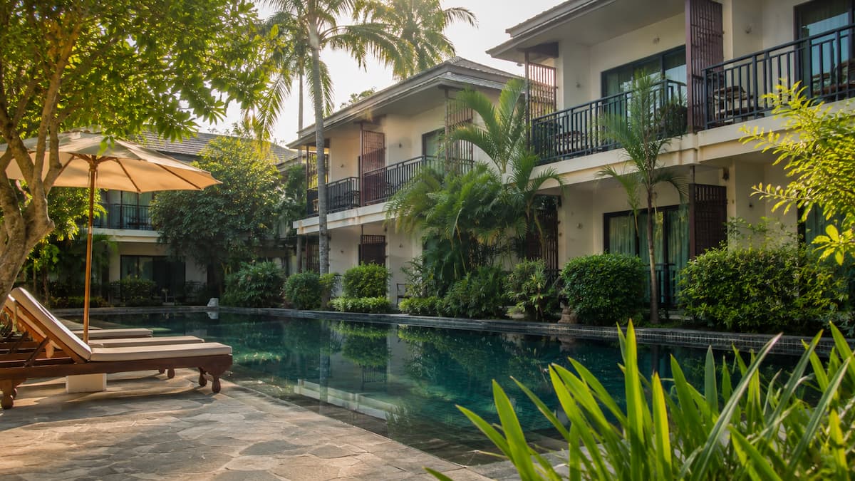 Peaceful accommodation in Patong featuring a tranquil tropical pool and lush gardens in our Patong Travel Guide.