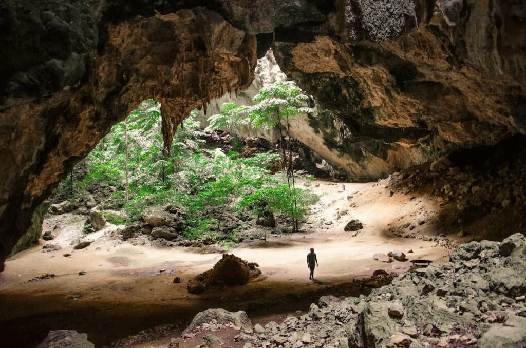 Traveller exploring Phraya Nakhon Cave, one of the must-see attractions in Central Thailand.