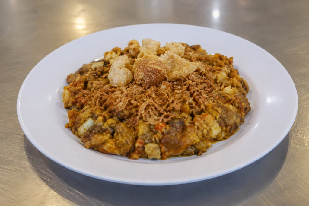 Phuket oh tao made with small oysters, egg, taro and sticky batter, topped with crispy pork crackling.