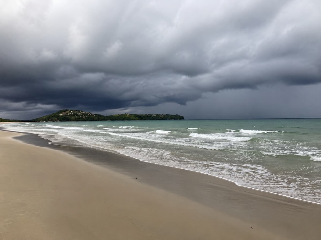 Phuket beach with rough seas and storm clouds during the rainy season