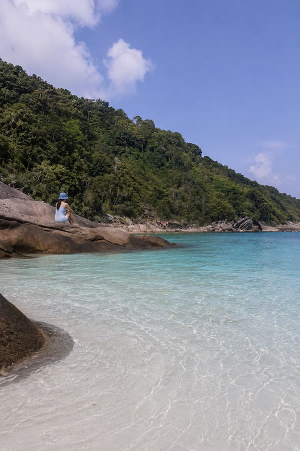 Clear turquoise water, white sand and granite rocks in the Similan Islands, featured in our Phuket travel guide.