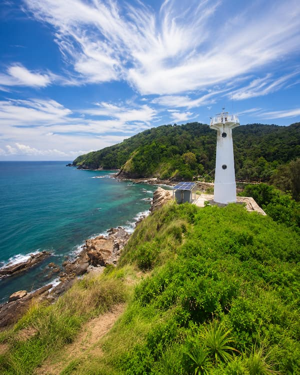 outhern Thailand travel guide view of the lighthouse and rugged coastline in Mu Ko Lanta National Park.