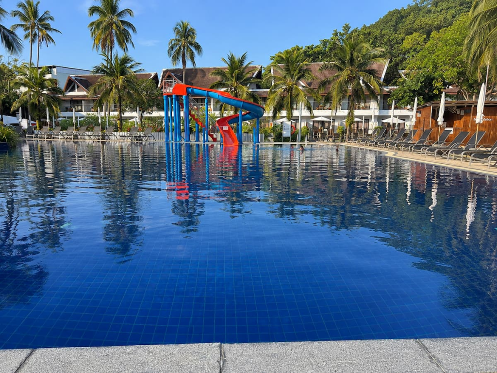 Swimming pool and colourful waterslide at Sunwing Kamala Beach, featured in our Phuket travel guide.