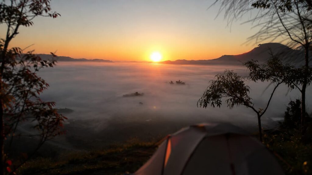 Thailand scenic viewpoints at Khao Takhian Ngo with sunrise over a sea of mist and mountains in Phetchabun