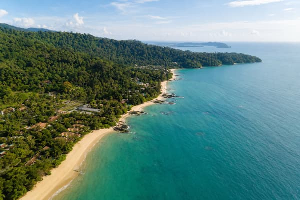 Thailand travel guide aerial view of Khao Lak’s beaches, forested hills and blue Andaman coastline.