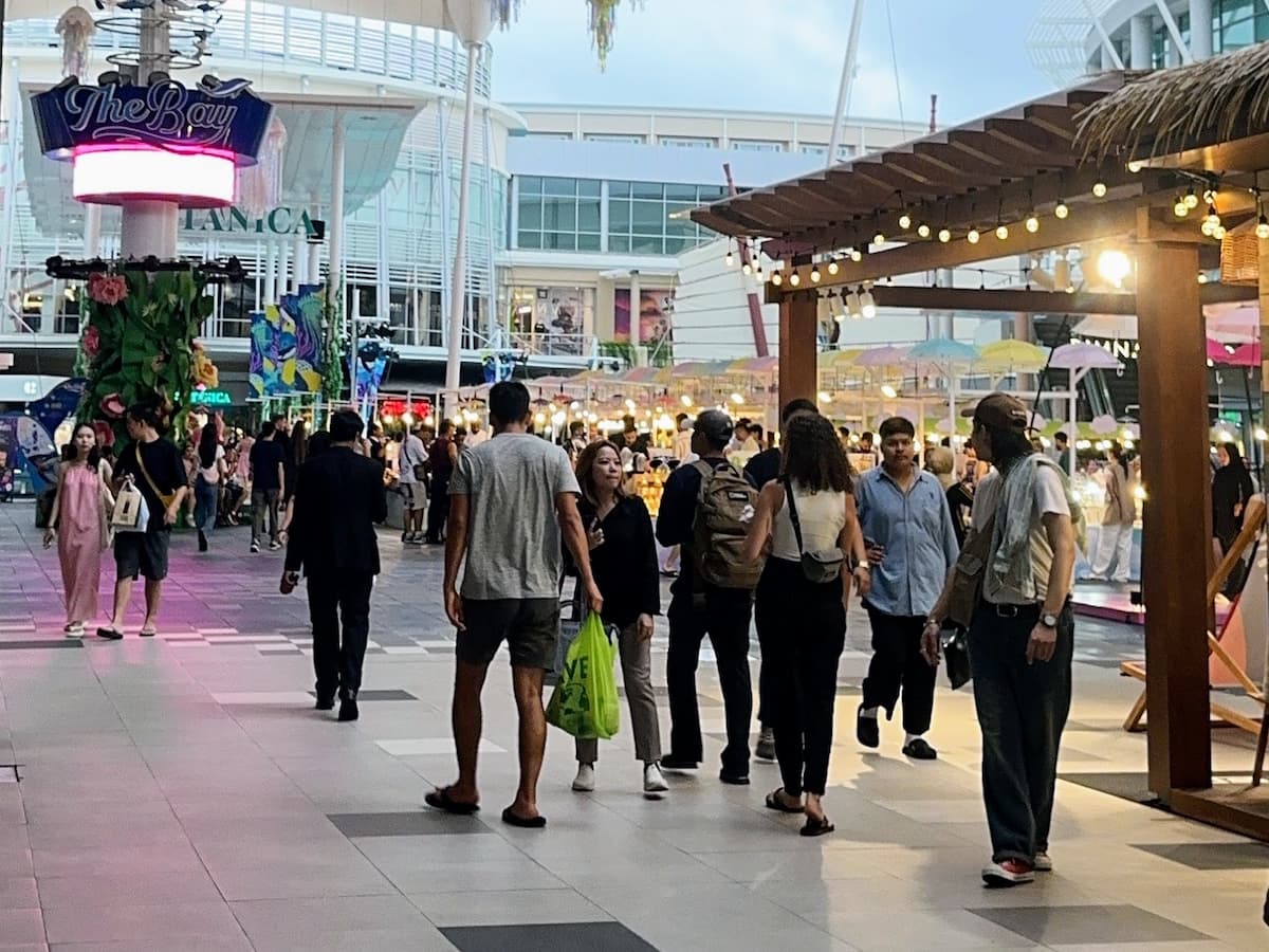 Visitors walking through Central Patong within easy reach of shopping, dining and entertainment in our Patong Travel Guide.